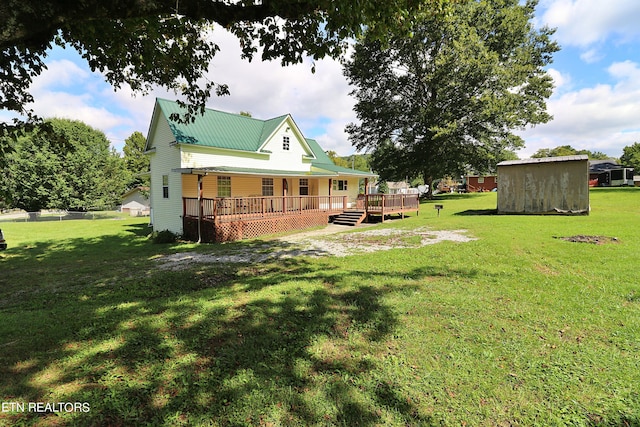 view of yard featuring a deck and a shed