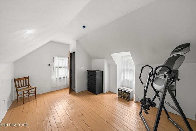 interior space featuring light hardwood / wood-style flooring and vaulted ceiling