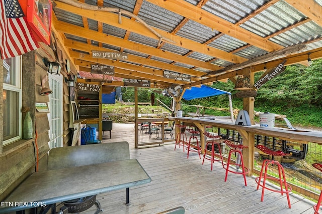 wooden terrace featuring exterior bar