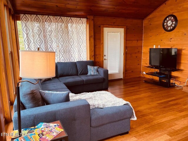 107 Dream Way, Sevierville, TN 37876 - living room featuring wooden ceiling, light wood-type flooring, wood walls, and lofted ceiling