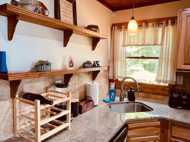 107 Dream Way, Sevierville, TN 37876 - kitchen featuring hanging light fixtures, sink, and light stone counters