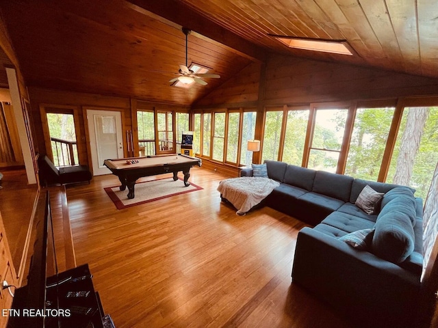 107 Dream Way, Sevierville, TN 37876 - living room featuring vaulted ceiling with skylight, dark hardwood / wood-style floors, wood ceiling, and pool table