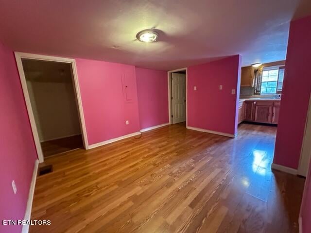 spare room featuring hardwood / wood-style floors