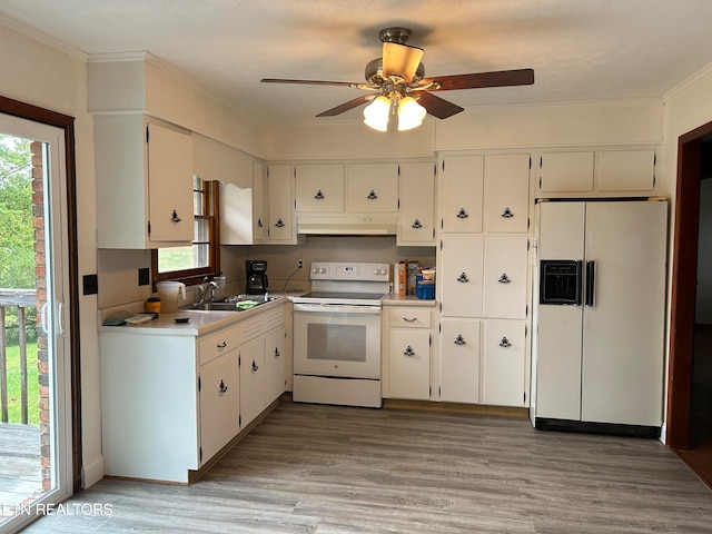 kitchen with white appliances, ceiling fan, sink, white cabinets, and light hardwood / wood-style floors