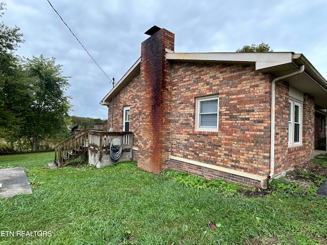 view of home's exterior featuring a yard