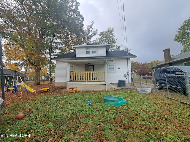 rear view of property with central air condition unit and covered porch