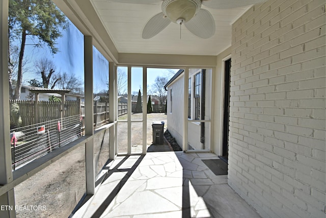 sunroom / solarium with ceiling fan