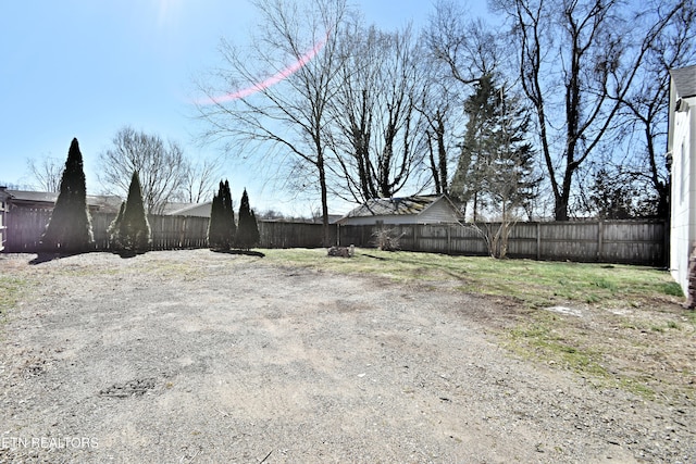 view of yard with a fenced backyard