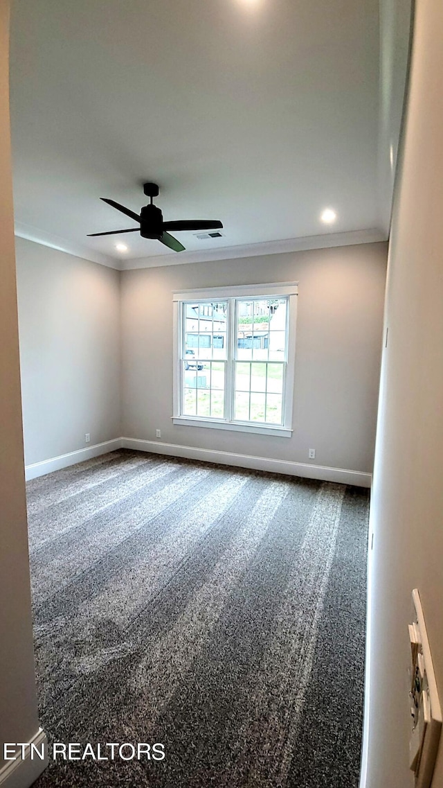 carpeted spare room with visible vents, baseboards, a ceiling fan, crown molding, and recessed lighting