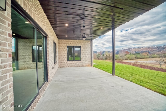 view of patio / terrace featuring ceiling fan