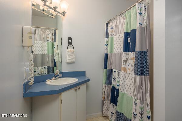 bathroom featuring tile floors and vanity