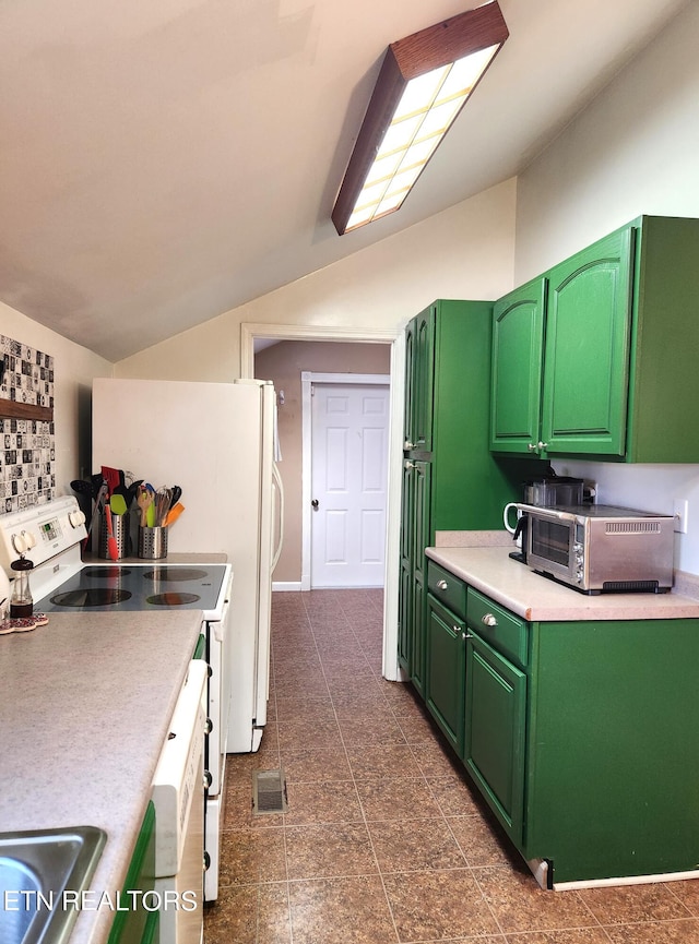 kitchen with lofted ceiling, white range, green cabinetry, and dark tile floors