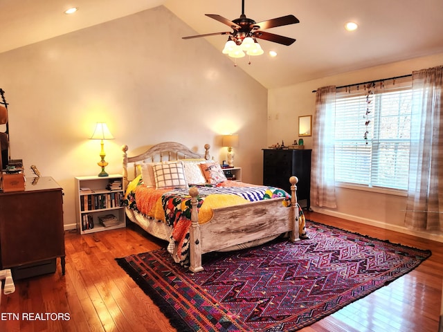 bedroom featuring high vaulted ceiling, dark hardwood / wood-style flooring, and ceiling fan