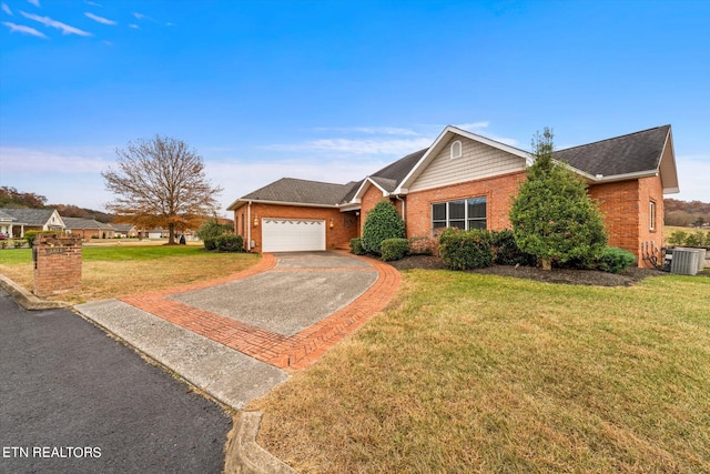 ranch-style house featuring a front yard, central AC, and a garage