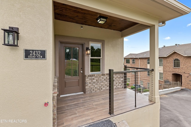 entrance to property with a balcony