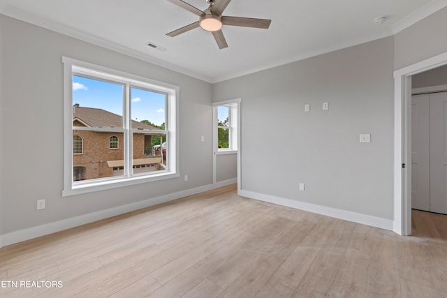 empty room featuring ceiling fan, light hardwood / wood-style flooring, and ornamental molding