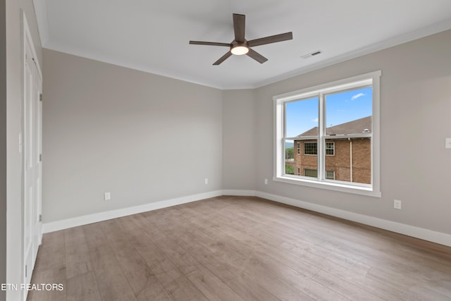 unfurnished room with crown molding, ceiling fan, and light hardwood / wood-style flooring