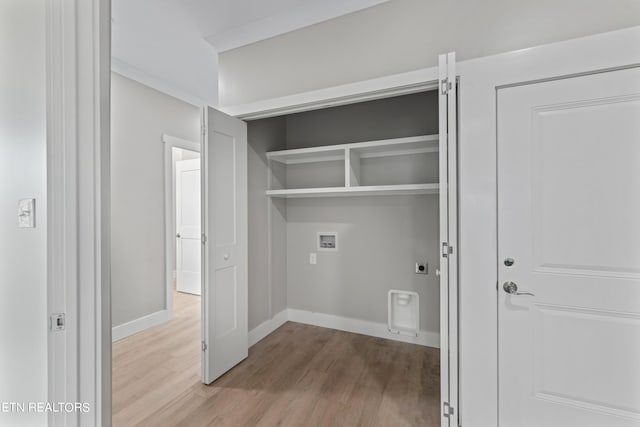 clothes washing area with wood-type flooring, electric dryer hookup, and hookup for a washing machine