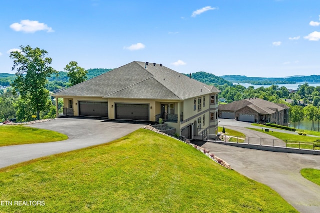 view of front of property with a front lawn and a garage