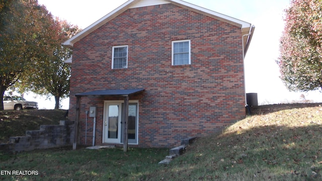 rear view of property featuring french doors