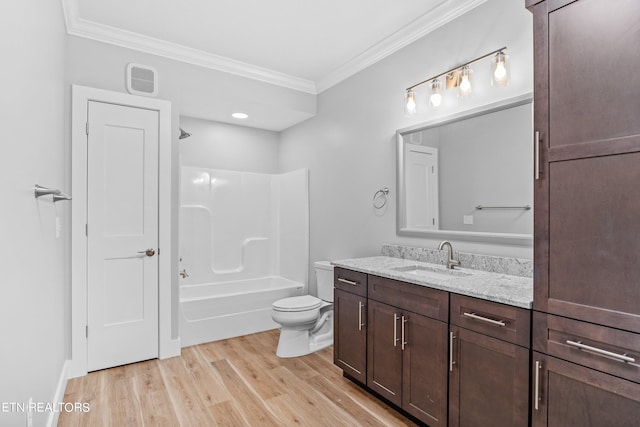 full bathroom with toilet, bathtub / shower combination, crown molding, wood-type flooring, and vanity