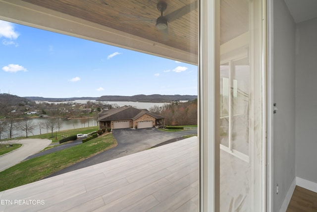 exterior space featuring a water view, hardwood / wood-style flooring, and wood ceiling