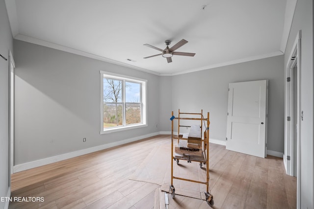 unfurnished room with ornamental molding, ceiling fan, and light hardwood / wood-style flooring