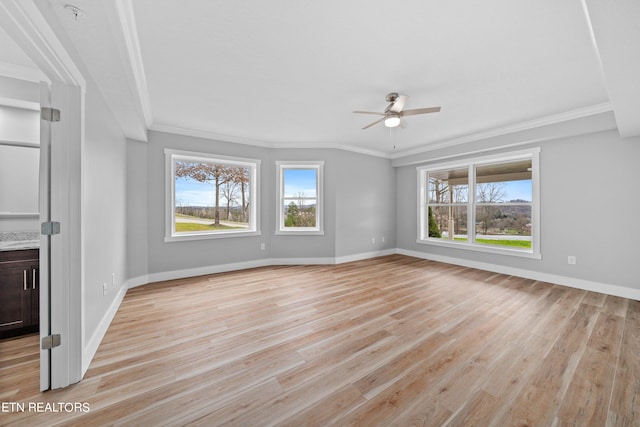 unfurnished living room with ceiling fan, light hardwood / wood-style floors, and crown molding