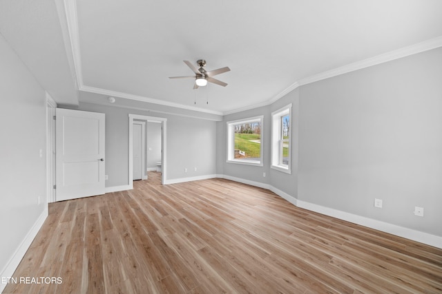 spare room featuring ceiling fan, light hardwood / wood-style floors, and crown molding