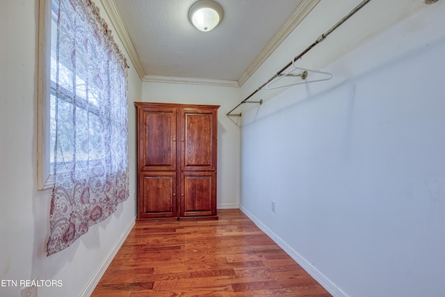 spacious closet featuring hardwood / wood-style floors