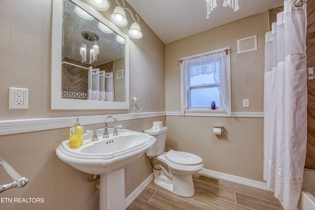 bathroom with tile floors and toilet