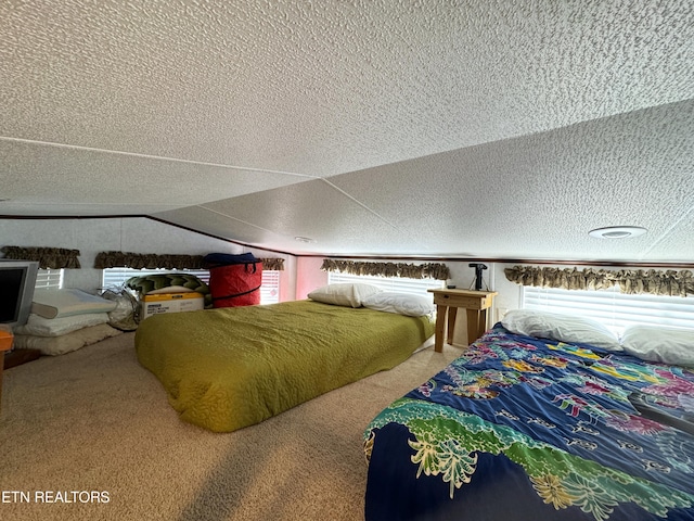 bedroom featuring carpet floors, a textured ceiling, and lofted ceiling