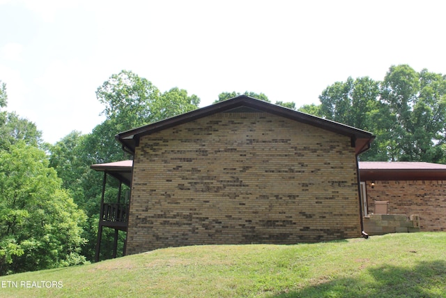 view of property exterior with a lawn