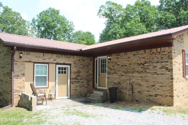 rear view of property featuring a patio