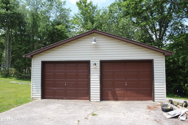 garage with a yard