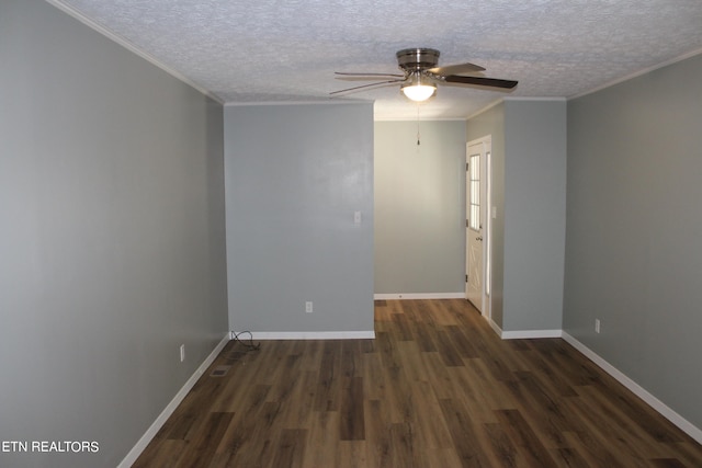 empty room with ceiling fan, ornamental molding, dark wood-type flooring, and a textured ceiling