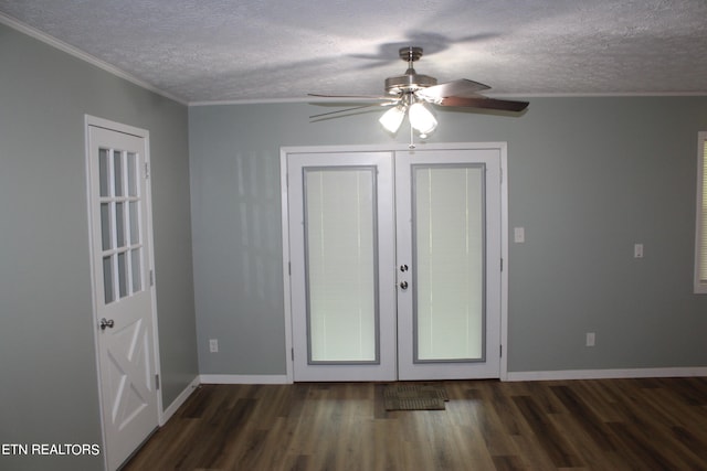 entryway featuring ceiling fan, a textured ceiling, french doors, ornamental molding, and dark hardwood / wood-style flooring