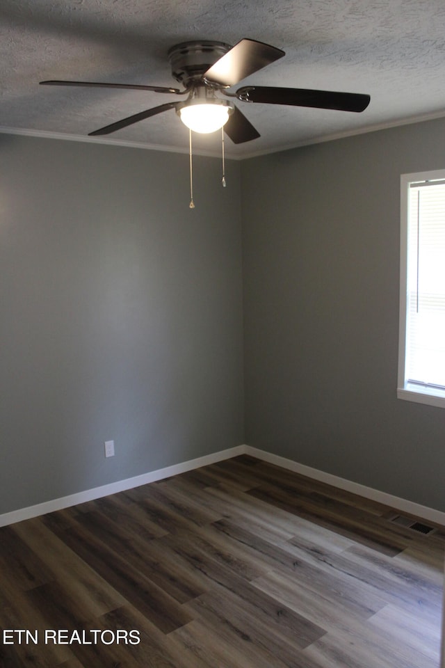 spare room featuring ceiling fan, a textured ceiling, and dark hardwood / wood-style flooring