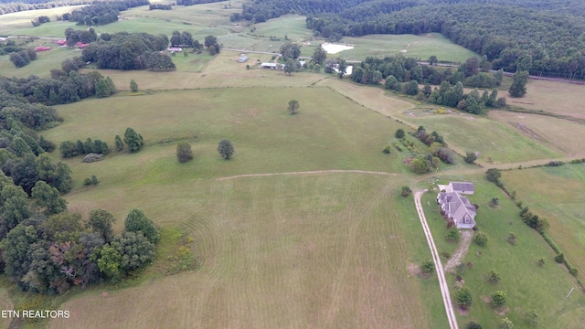 birds eye view of property featuring a rural view