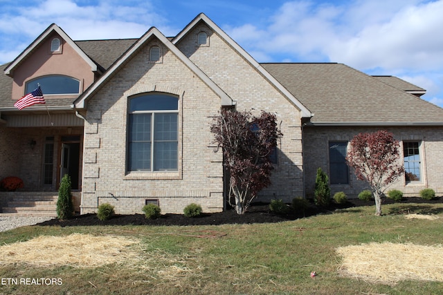 french country home with a front lawn