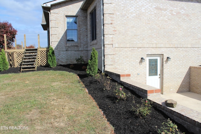 view of property exterior featuring a lawn