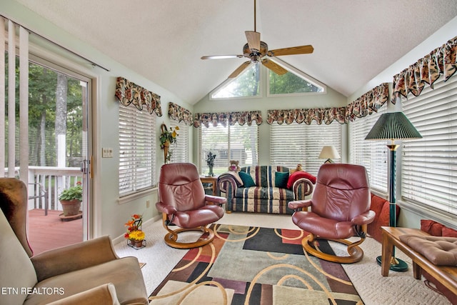 sunroom / solarium with ceiling fan and lofted ceiling