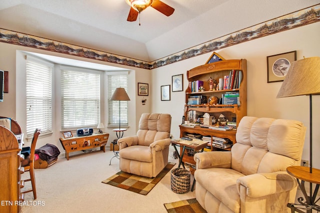 sitting room featuring vaulted ceiling, carpet floors, and ceiling fan