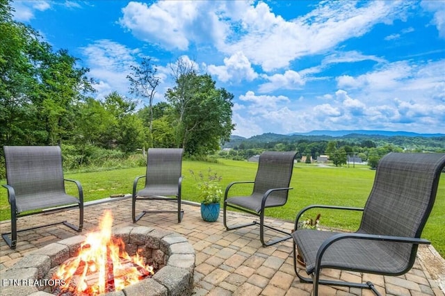 view of patio / terrace with a fire pit