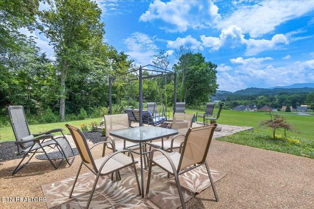 view of patio / terrace with a mountain view