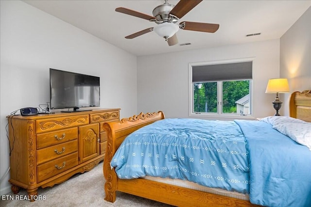 bedroom with light colored carpet and ceiling fan