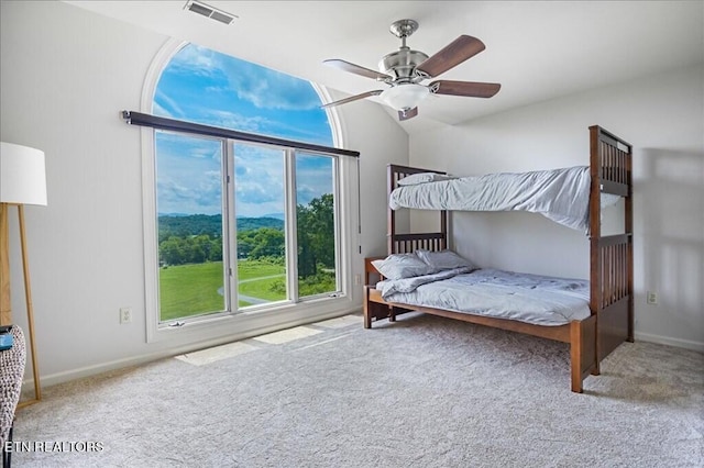 bedroom with light carpet and ceiling fan