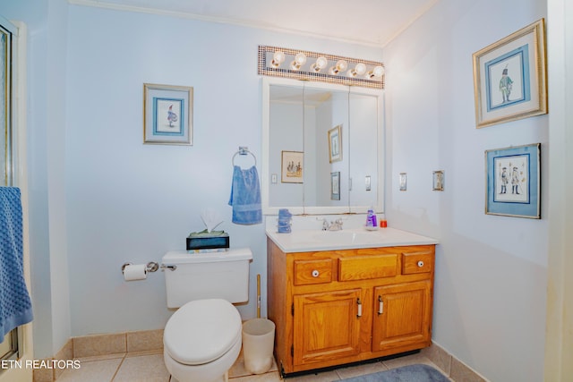 bathroom featuring tile floors, toilet, and vanity