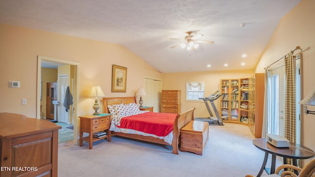 carpeted bedroom with vaulted ceiling, ceiling fan, and a textured ceiling