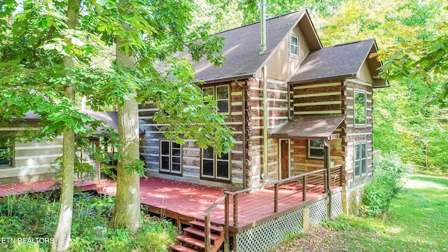 view of home's exterior with a deck